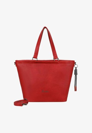 Sac cabas en cuir rouge de forme triangulaire, avec deux poignées supérieures, une bandoulière amovible et un accessoire décoratif en forme de pompon.