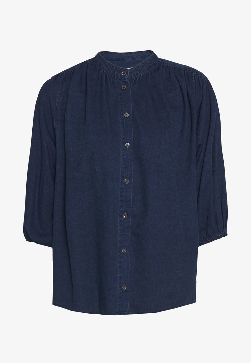 Blouse boutonnée bleu marine avec épaules froncées, manches bouffantes trois-quarts à poignets élastiques et col rond.