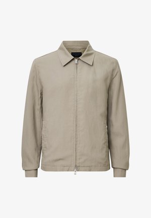 Beige Kapuzenjacke mit Reißverschluss, Kragen, langen Ärmeln und glatter Textur; verfügt über einen Frontreißverschluss und minimalistische Designelemente.