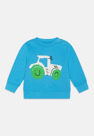 Blue sweatshirt featuring a white tractor graphic with green wheels and smiling faces. Made of soft fabric with ribbed cuffs and neckline.