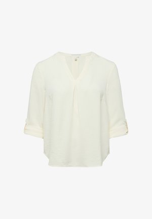 Kremowa bluzka z długim rękawem, z dekoltem w kształcie litery V, z przodu z plisą i podwiniętymi mankietami zapinanymi na guziki.