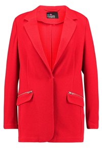 Blazer rouge à manches longues avec des revers crantés, deux poches frontales zippées avec rabats, et une étiquette noire à l'intérieur du col.