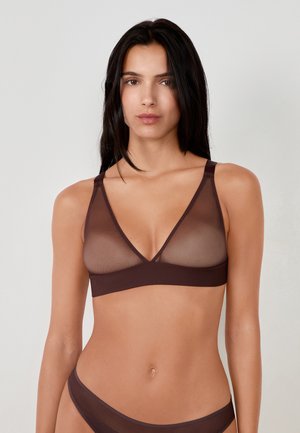 Bralette wireless marrone con parte superiore in rete trasparente, design a V, spalline regolabili e fascia in tessuto morbido. Senza imbottitura né ferretto.