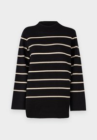 Pull noir à manches longues avec des rayures horizontales beige et un col rond montant sur un fond uni.