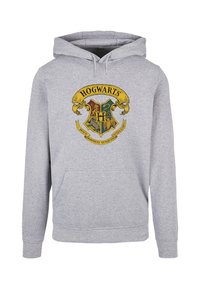 Grey hoodie featuring a large Hogwarts crest graphic in yellow, red, green, and blue. Snowflake texture and a front pocket design.