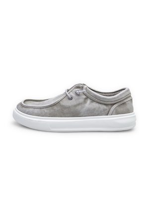 Gray canvas sneaker with white rubber sole, round toe, two eyelets, and a soft, padded collar. Minimalistic design with smooth texture.