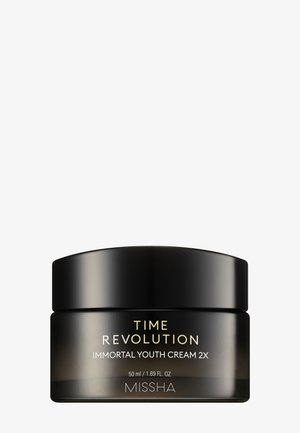 Mustaa purkkia Missha Time Revolution Immortal Youth Cream 2X, 50 ml, etiketissä kultaa ja valkoista tekstiä.