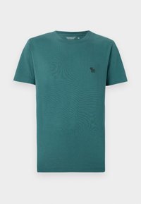 Kurzarm-T-Shirt mit Rundhalsausschnitt aus tealfarbenem Baumwollmaterial. Verfügt über ein kleines schwarzes Logo auf der Brust und hat eine glatte, weiche Textur.