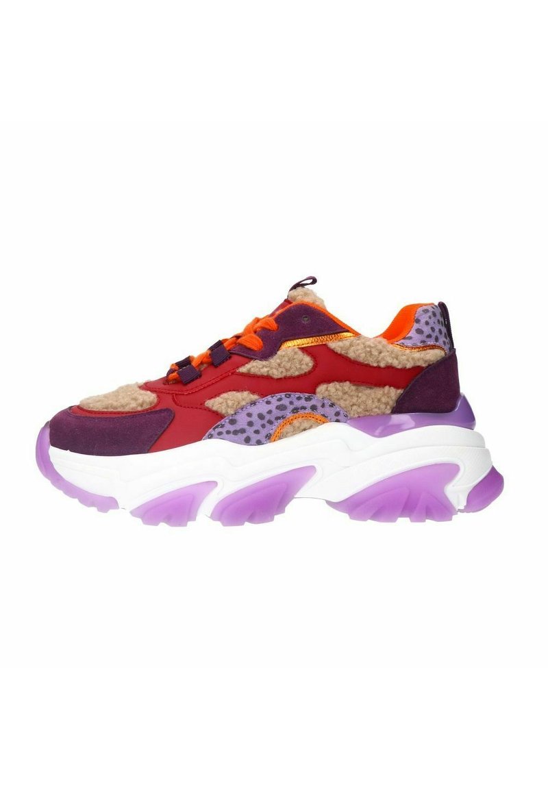 Chunky sneaker with multicolored panels: red, purple, and orange. Features a textured upper, fluffy detailing, and a bold, purple-tinted sole.