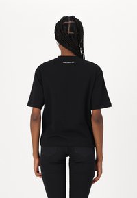 KARL LAGERFELD OVERSIZED SIGNATURE HEM - Lihtne T-särk - black
