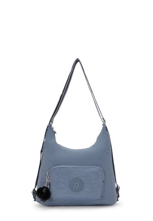 Hobo bag in soft blue nylon, featuring a front pocket, adjustable shoulder strap, logo patch, and a detachable pom-pom charm.