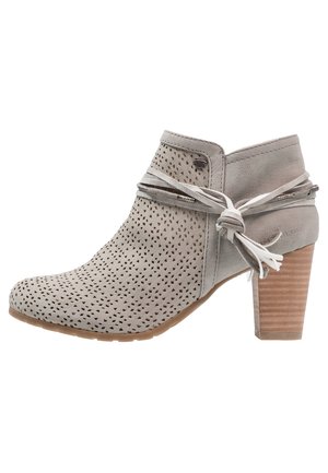 Gray suede ankle boot with perforated design, tied accents, and a chunky heel. Features a side zipper for easy wear.