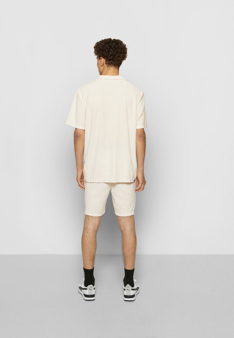 Herren Trainingsanzüge | Puma DOWNTOWN TOWELING Jogginghose offwhite - XX95759 Herren Trainingsanzüge | Puma DOWNTOWN TOWELING Jogginghose offwhite - XX95759