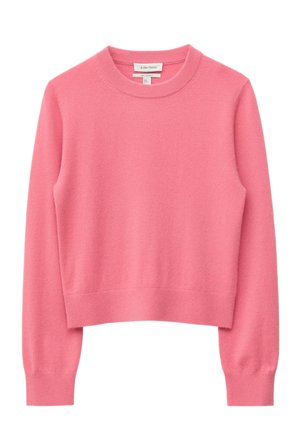 Pull-over rose à manches longues, col rond, avec poignets et ourlet côtelés. Confectionné en matière douce et texturée. Design simple.