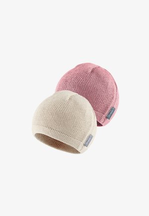 Two knit beanies, one beige and one light pink. Both have a rounded top and a small logo patch on the side, with textured fabric.