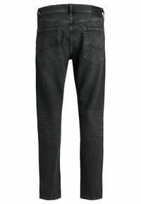 Svarta denimjeans med rak benmodell, med två bakfickor med rundad söm och en läderliknande remsa vid midjan.