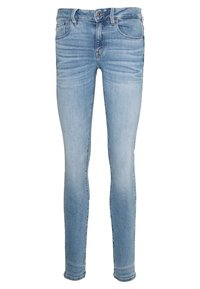 Vaqueros ajustados de color azul claro con botón frontal y cremallera, cinco bolsillos y un leve desvanecimiento en los muslos y las rodillas.