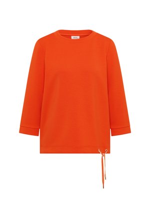 Fel oranje shirt met lange mouwen, ronde hals en een koorddetail aan de onderkant van de rechterzoom.