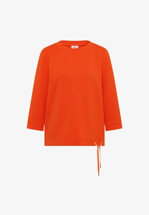 Maglietta arancione brillante a maniche lunghe con scollo rotondo e dettaglio con coulisse sull'orlo inferiore destro.