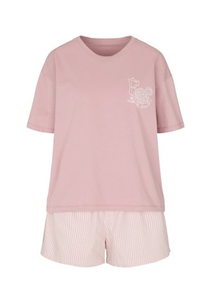 Donna che indossa una maglietta rosa chiaro con un disegno a linee bianche di pancake, caffè, caffettiera e il testo Sunday Brunch.