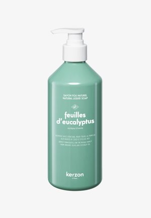 Turquoise liquid soap bottle with a pump, featuring a curved design and white text stating "feuilles d’eucalyptus" and "kerzon."