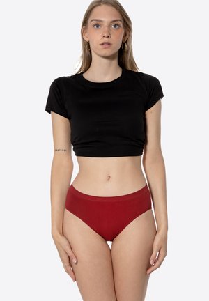 Black cropped t-shirt with short sleeves, paired with high-waisted red brief underwear. Smooth fabric texture, simple silhouette, no patterns.