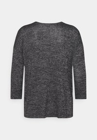 Svart och grå långärmad topp i texturerat tyg. Har en avslappnad passform och bred rundad halsringning, med en enkel, odekorerad design.