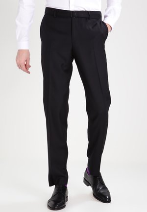 - Spodnie materiałowe