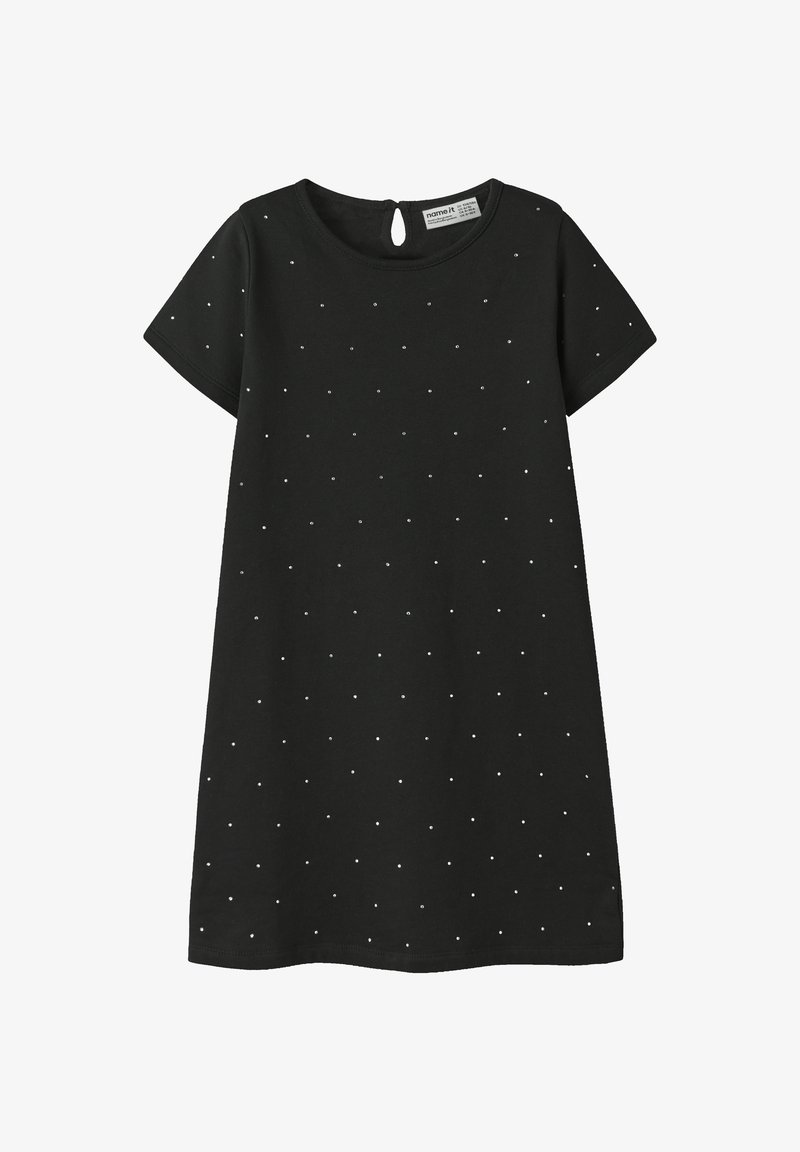 Schwarzes Kurzarmkleid mit rundem Ausschnitt und Rückenschlitz. Verziert mit silbernen Punktapplikationen und aus weichem Baumwollstoff gefertigt.