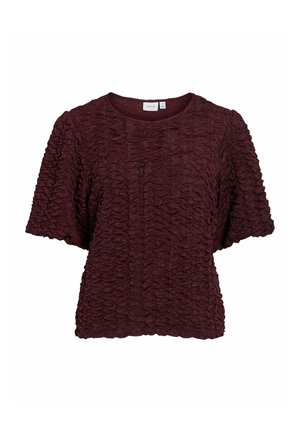 Haut bordeaux à manches courtes en tissu texturé froncé. Encolure ronde et coupe ample. Le tissu doux met en valeur le design global.