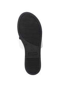 Semelle en caoutchouc noir avec motif de grip texturé. Semelle intérieure et sangle blanches, design incurvé. Logo de la marque visible près du talon. Taille 37 indiquée.