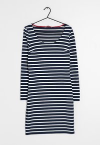 Långärmad klänning med rund halsringning, i växelvis marinblå och vita horisontella ränder. Mjuk tyg med sprund på sidorna av nederkant.
