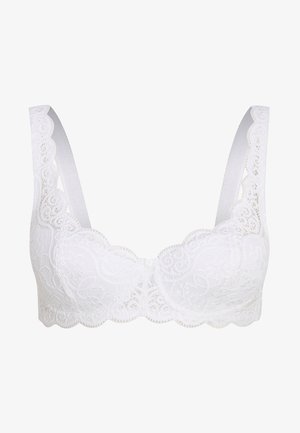 Balta mežģīņu krūšturis ar viļņotām malām, platām siksnām un ziedu rakstiem. Mīksta tekstūra, bez stieples, ar priekšējo aizdari.