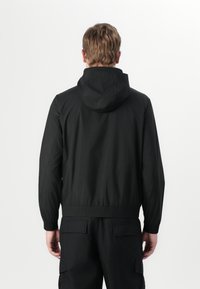 Calvin Klein Vodotesná bunda - black