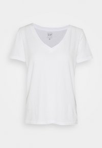 White cotton V-neck t-shirt with short sleeves, a relaxed fit, and tag near the neckline. Smooth texture, no patterns or accents.