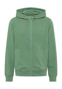 Haut à capuche zippé vert en tissu doux. Comprend une capuche, des cordons de serrage et des poches latérales. Fini texturé avec des poignets et une taille côtelés.