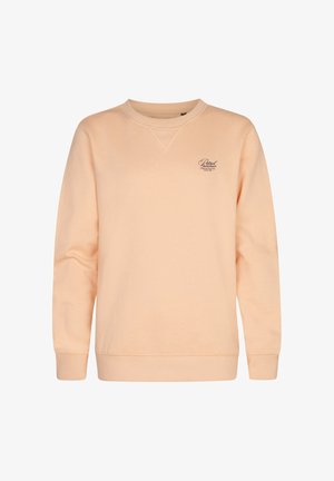 Sweat-shirt pêche clair à manches longues, poignets côtelés et col rond. Associé à un jean gris et des baskets blanches. Contient un petit détail logo.