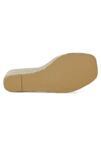 Soletta in sughero beige con texture a righe, caratterizzata da una parte superiore liscia e di colore chiaro. Plantare piatto per un comfort ottimale.
