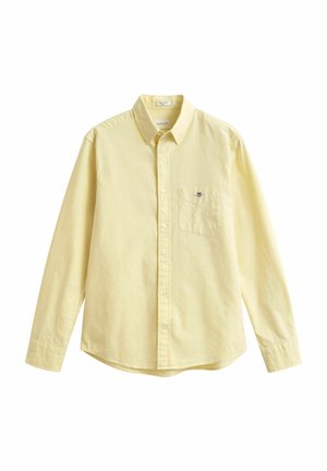 Chemise pour homme jaune clair à boutons, manches longues, avec une poche poitrine ornée d'une petite broderie de logo.