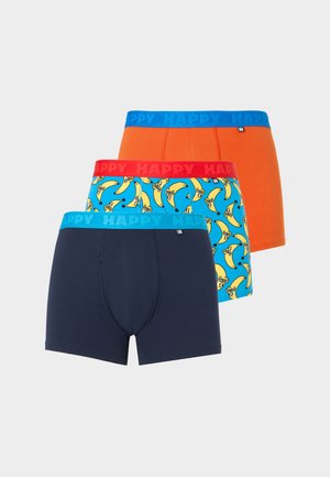 Three men's boxer briefs in navy blue, blue with yellow bananas, and solid orange, each with "HAPPY" branded elastic waistbands.