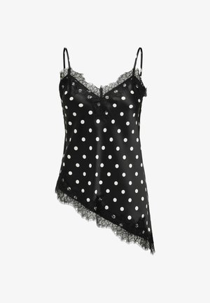 Camisola de satén negro con lunares blancos, dobladillo asimétrico con encaje, escote de encaje y finos tirantes ajustables.