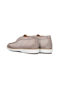 Gray suede slip-on shoes with a rounded toe and minimalistic design, featuring a white rubber sole and subtle stitching details.