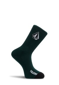 Chaussette crew vert foncé avec orteil noir, logo Volcom blanc sur le pied et symbole géométrique blanc sur la cheville.
