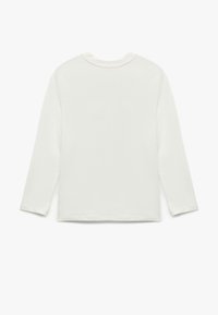 Langærmet hvid skjorte lavet af blødt bomuld, med rund halsudskæring og lige kant. Simpelt, sømløst design med minimale detaljer.