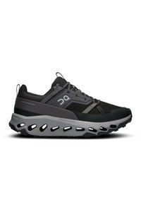 Schwarze und graue Sportschuhe mit einem Obermaterial aus Mesh, gepolstertem Schaft und einer auffälligen weißen Zwischensohle mit Ausschnitten für Flexibilität.
