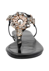 Black flat sandal with a thin strap, adorned with grey gems and rose gold accents in a floral design. Smooth leather footbed.