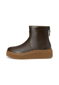Rudos odinės kulkšninių batus su grioveliniu guminio pado, su šoniniu užtrauktuku ir elegantišku, liekniu dizainu.