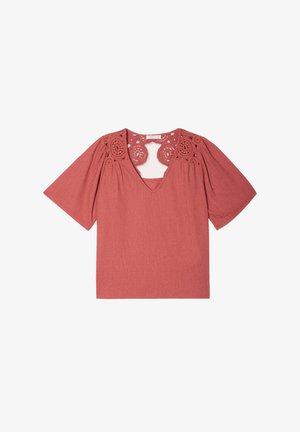 Rose-colored blouse with a V-neck, short puff sleeves, and crochet lace accents on shoulders. Soft, textured fabric.