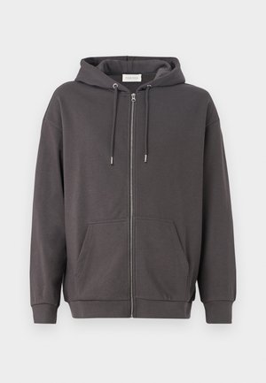 Šedá mikina na zip s kapucí na šňůrku, velkými předními kapsami a žebrovanými manžetami; vyrobená z měkké, hladké tkaniny.