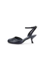 Black leather slingback shoe with a rounded toe, thin ankle strap, and a 3-inch cone heel. Smooth texture with minimalist design.
